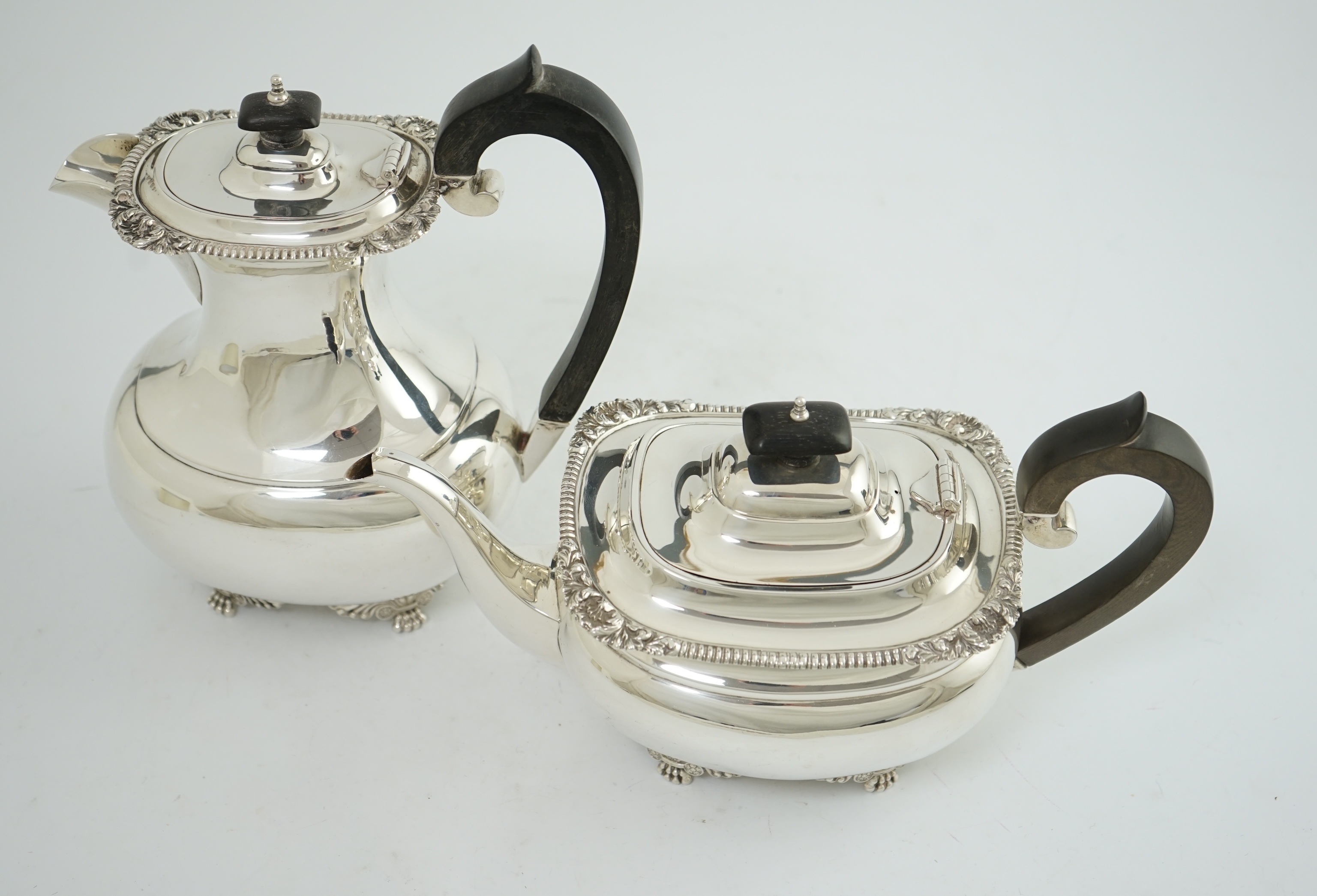 A George V silver hot water pot and matching teapot, by Reid & Sons